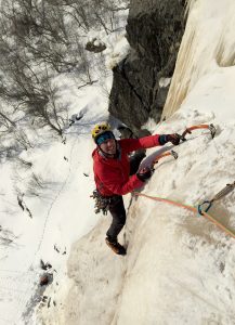 man climbs ice in norway
