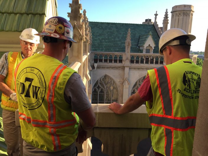 men on church balcony