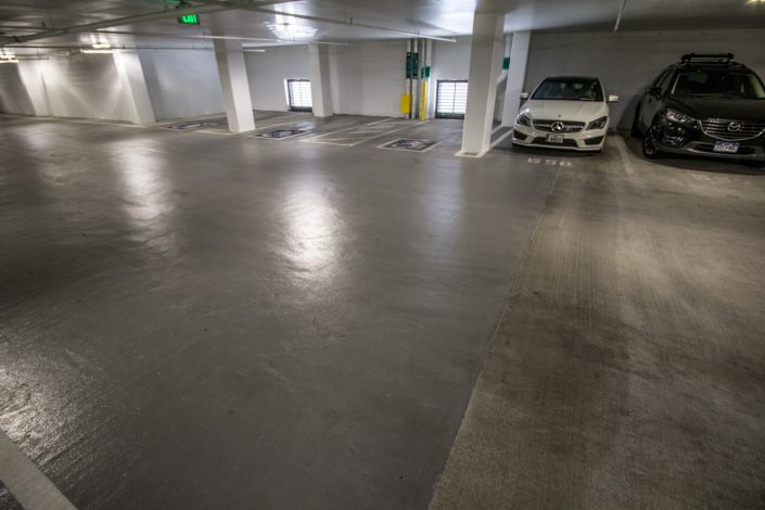traffic coating applied to parking garage on the left side of the image