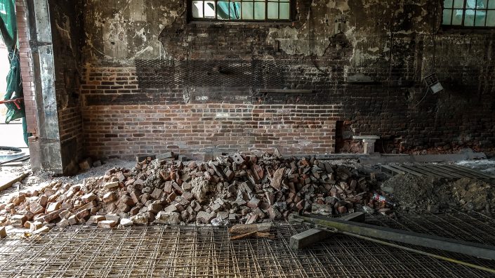 bricks on the floor of an old building under renovation