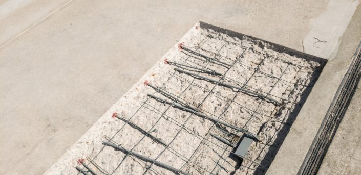 Damaged concrete ready for repair on parking garage