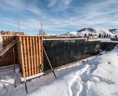 Cold applied waterproofing applied to a building foundation in Gunnison, Colorado